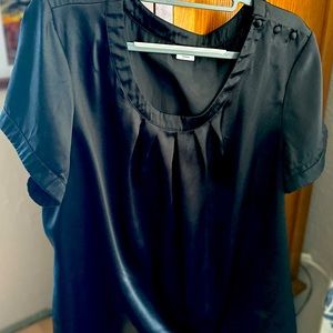 Black shiny short sleeve top.